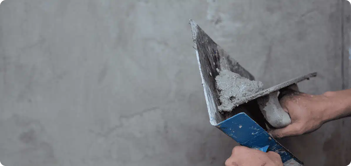 Application d'une trame en fibre de verre pour l'entoilage d'une façade Phénix